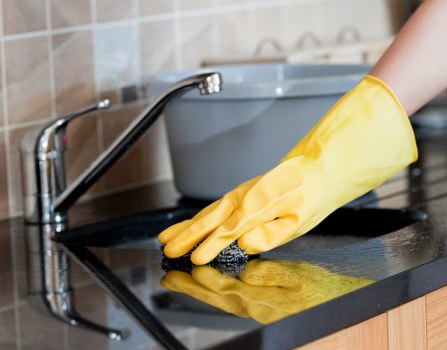 Technician preparing carpet cleaning equipment in a safe environment